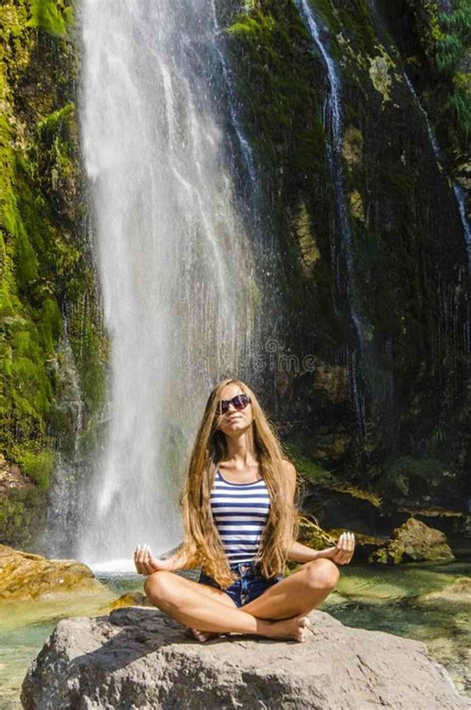 Woman Meditating Next To A Waterfall Unwinding Anxiety: New Science Shows How To Break The Cycles Of Worry And Fear To Heal Your Mind